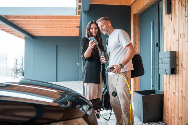 istock Sustainable Commute: Couple Preparing for Work with Electric Vehicle 2180976747