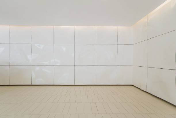 istock Modern empty room with white walls and tiled floor 2180978197