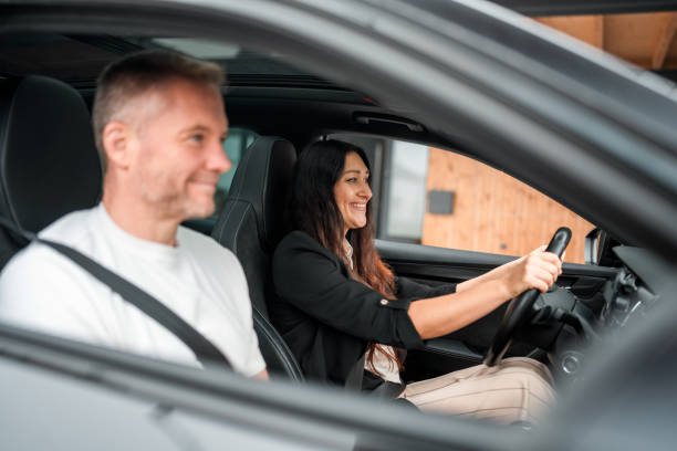 istock Eco-Conscious Commuters: Caucasian Couple With Electric Vehicle 2180979242