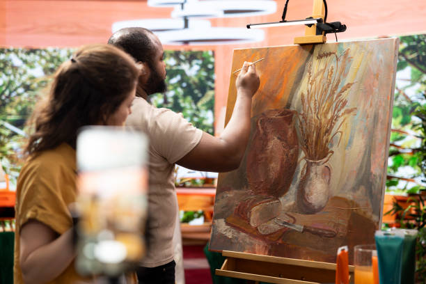 istock Team of painters recording an artistic tutorial for the internet 2180982753