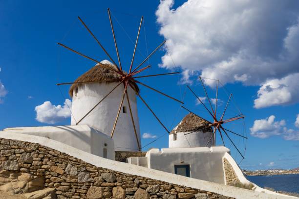istock Windmills on Mykonos Island, Greece, under a blue sky. 2180989757