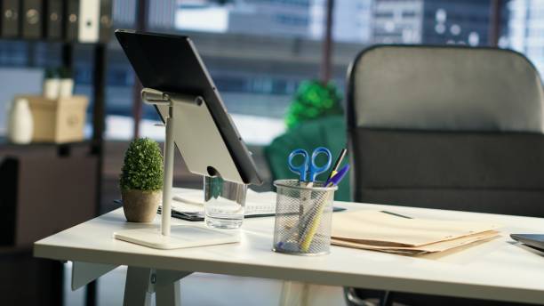 istock High end work environment empty office used in business industry 2180993760