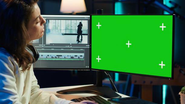 Photo editor selecting best photographs on isolated screen desktop computer Freelancer works on isolated screen desktop computer on digital portfolio showcasing edited videos. Video editor selecting best clips using retouching application on chroma key display, camera A female film editor stock pictures, royalty-free photos & images