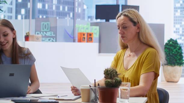 Young adult taking advice from financial advisor about student loans