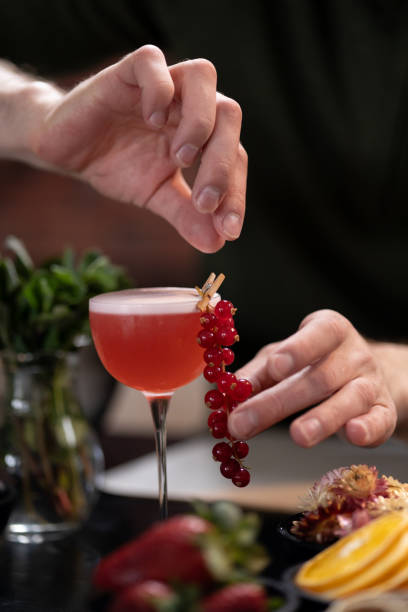 istock Crafting cocktail with fresh red currants in cozy indoor setting 2181002641