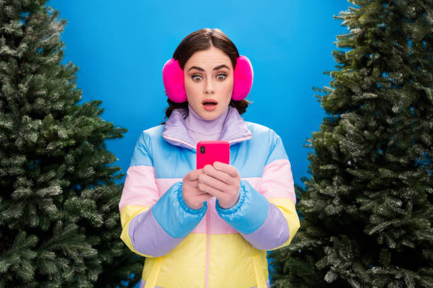 Photo of charming worried nervous afraid scared lady use device oops mistake problem walking street outside evergreen pine tree market