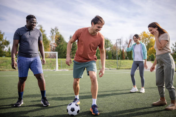 istock Joyful soccer game among friends on a bright day. 2181005317