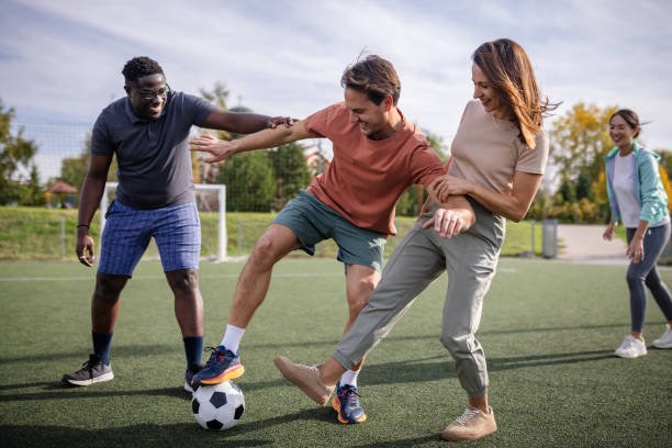 istock Lively soccer game played under clear blue skies. 2181005495