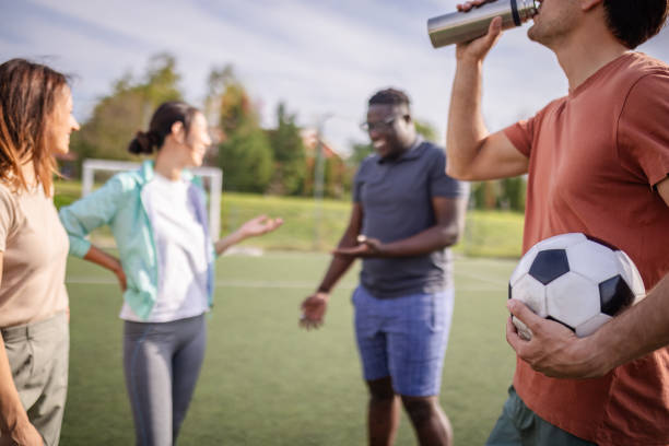 istock Friends energetically discussing on a soccer field 2181007001