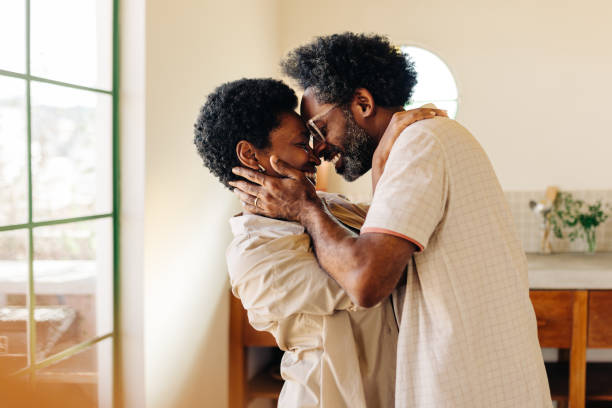 istock Happy afro-brazilian couple sharing intimate moment in kitchen 2181008014