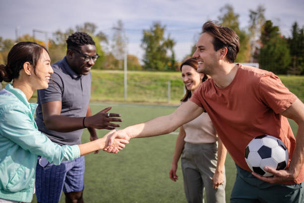 istock Handshake on soccer field symbolizes sportsmanship bond. 2181008818