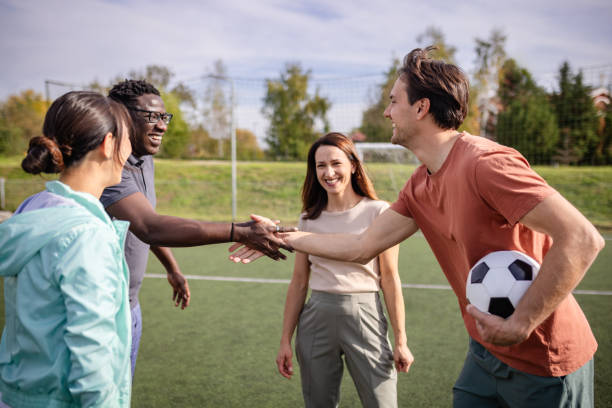 istock Team handshake before game fosters mutual respect on field. 2181009000