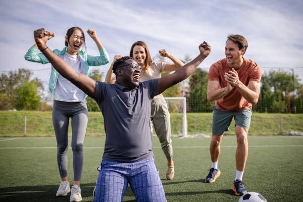istock Energetic celebration among friends on field 2181009276