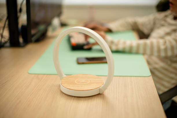 istock Modern ring lamp on desk, soft focus on keyboard user 2181011724