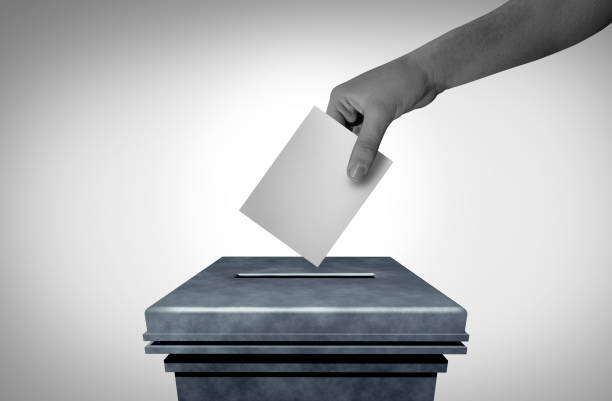Election Voter And Voting Symbol as presidential Elections or leadership vote representing democracy and a democratic choice as a citizen casting a ballot at a voting booth.
