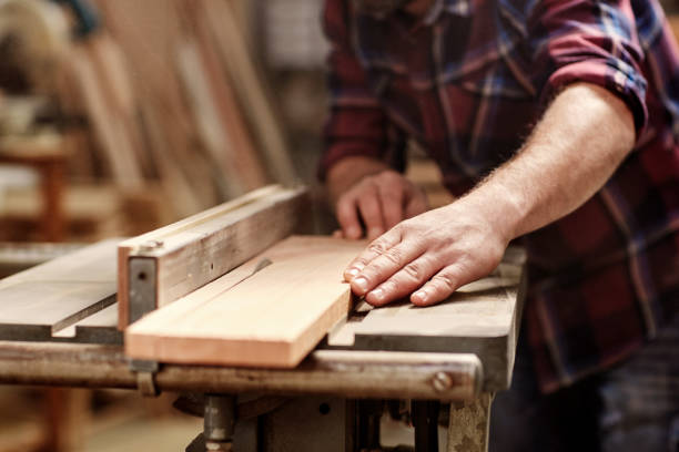 istock Plank of wood being cut with circular saw in workshop 2181014661