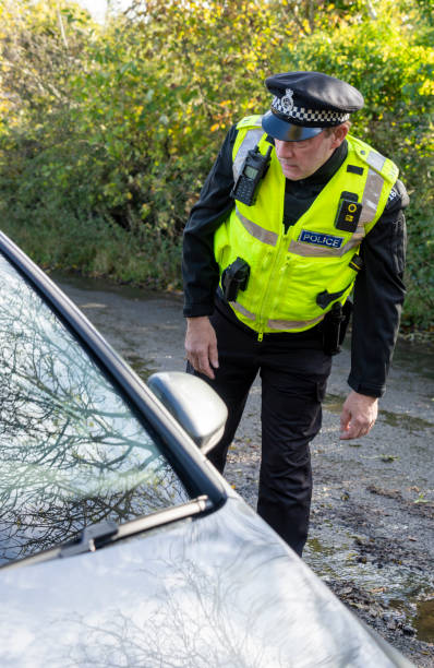 istock UK police officer approaching a parked car 2181016721
