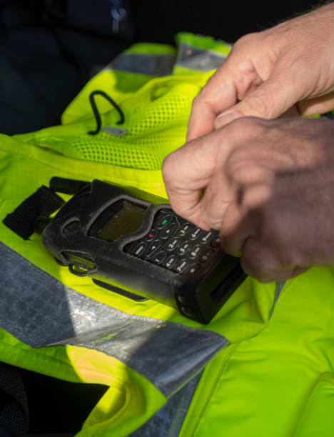 UK police officer uniform/jacket.  Hi vis jacket in the back of a car.