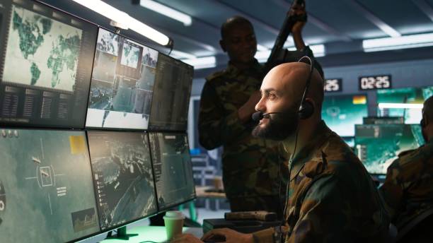 istock Close up on dispatcher working in war room operating surveillance tech 2181023006