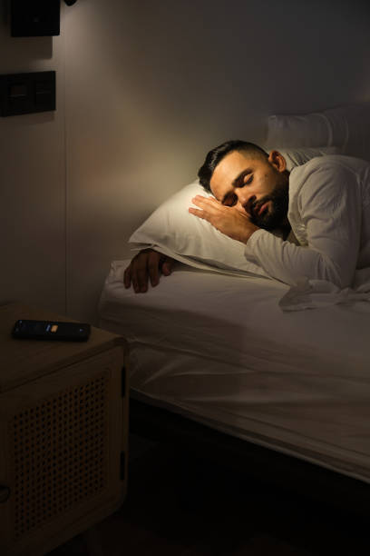 istock Bearded man sleeping soundly in bed at night 2181023856