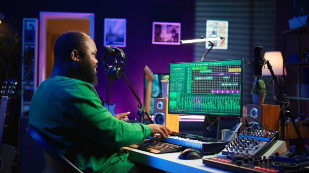 istock African american audio technician using piano synthesizer keys to add effects 2181027776