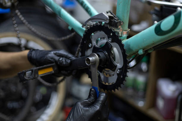 istock Bicycle mechanic adjusting crankset 2181028784