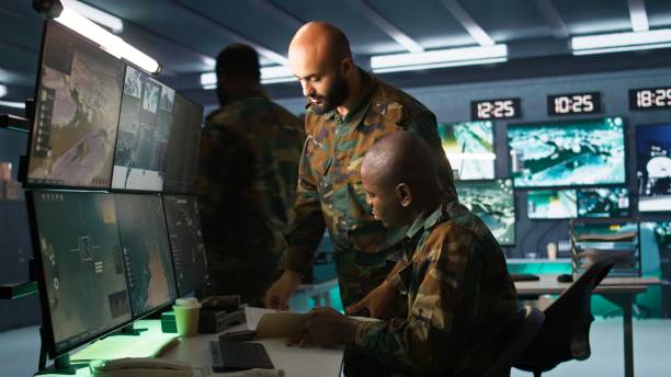 istock Team of military officers using tracking equipment to gain intel 2181030071
