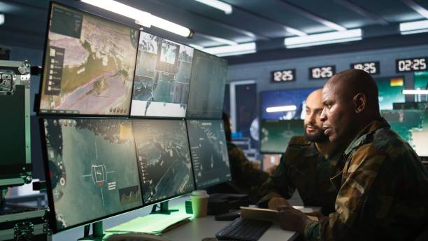 istock Army officers doing brainstorming in command center, looking at intel 2181030196