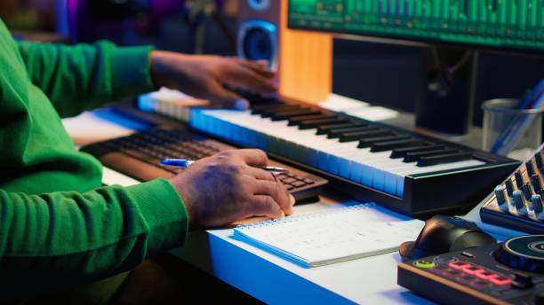 istock Songwriter writes down lines and melodic elements to create new tunes 2181031426