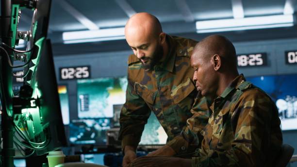 istock Soldier in military HQ base doing brainstorming with coworker 2181033836