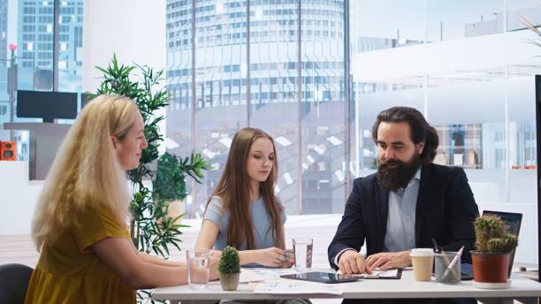 istock Welcoming financial advisor greeting clients 2181034217