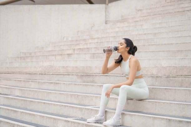 istock A women is getting ready to exercise. She is stretching her body 2181041737