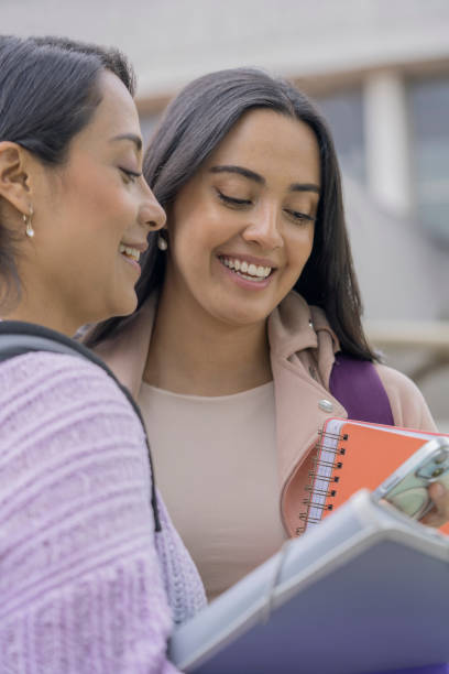 istock Two collage friends have a conversation outside the university 2181041746