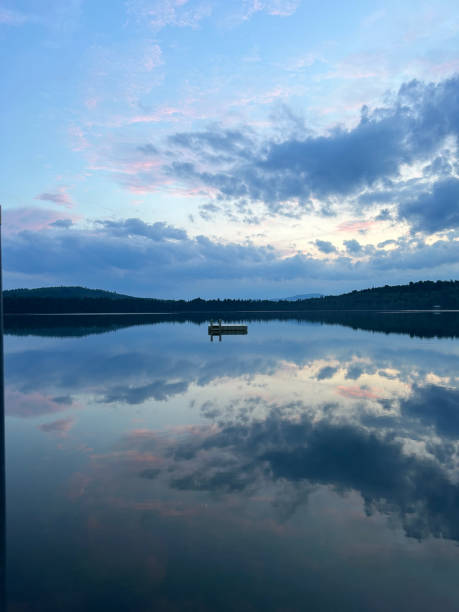Sunset sky reflected on a Maine pond