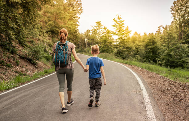 Mother and son going for walk.