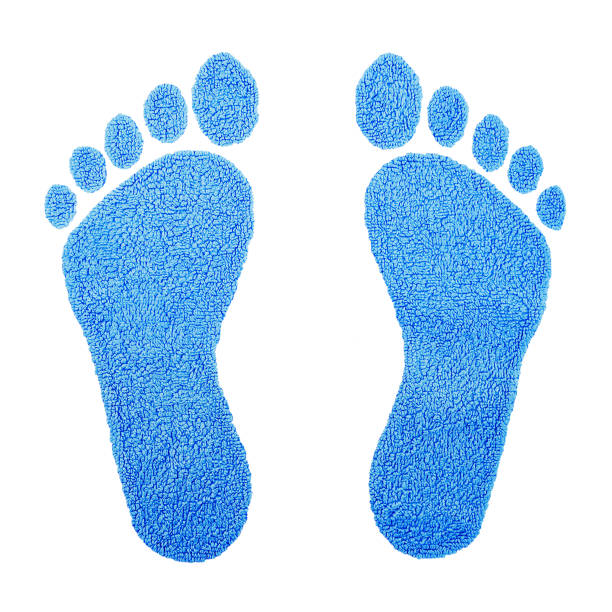 istock Human footprints made of soft blue carpet material on white background. 2181048210