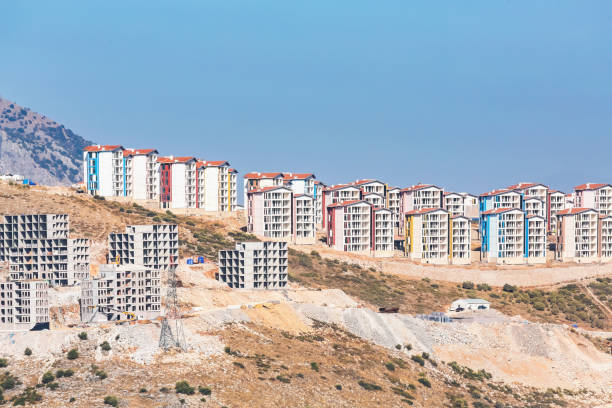 New multicolored apartment buildings under construction in Selcuk with mountain background. Izmir, Turkiye (Turkey)