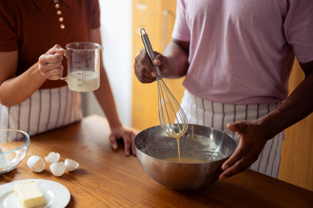 istock Couple Baking Together in Cozy Kitchen With Fresh Ingredients 2181058148