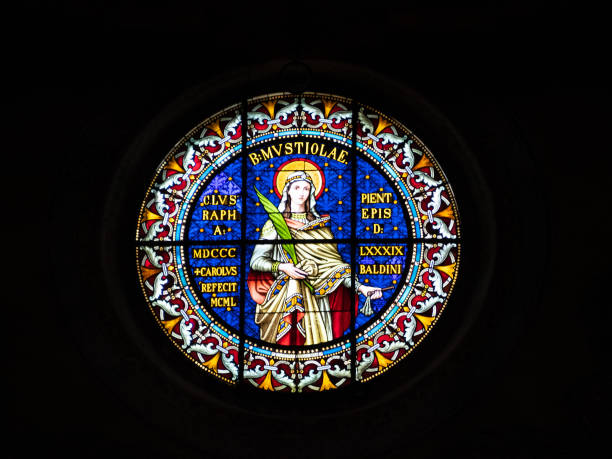Paris, France: A stained glass window showing the crucifix inside the Church of Saint Jean de Montmartre, located in Montmartre. The window is art nouveau style.