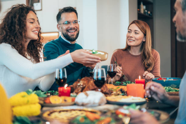 istock Family enjoy Thanksgiving lunch together 2181060204