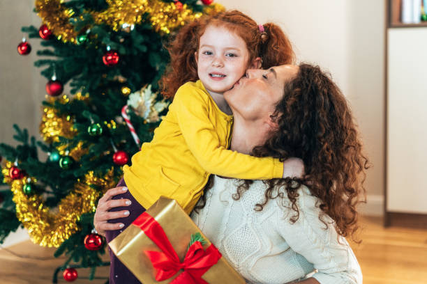 istock Mother and daughter on Christmas morning 2181060220