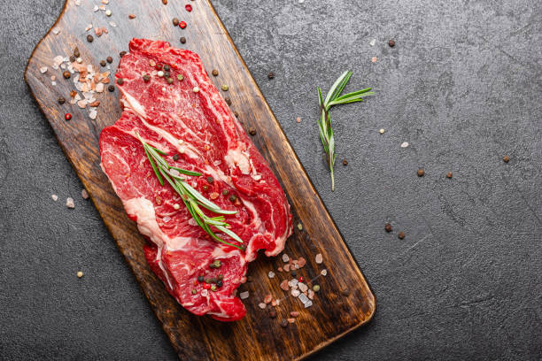 istock Raw beef meat on a wooden cutting board 2181063619