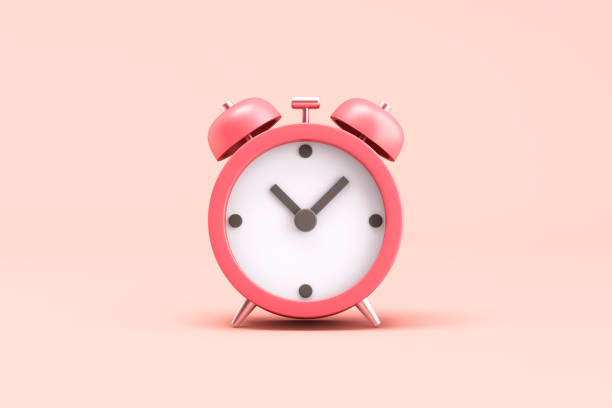 istock Retro alarm clock on pink background 2181064388