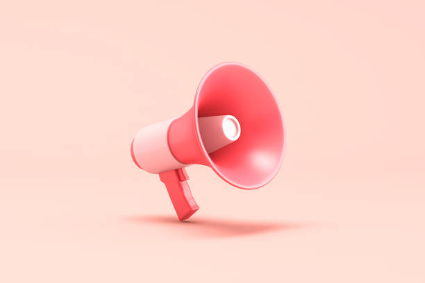 istock Single red electric megaphone with a handle stands on a pink background 2181064394
