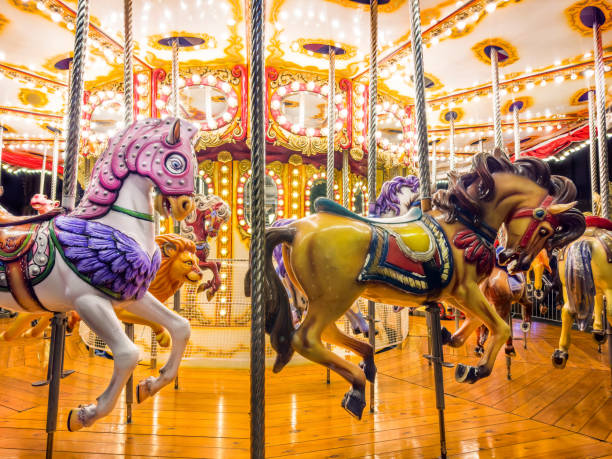 istock Close up empty turning carousel horses  in Christmas market 2181067714