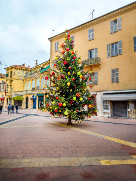 istock Town square with christmas tree and people 2181068064