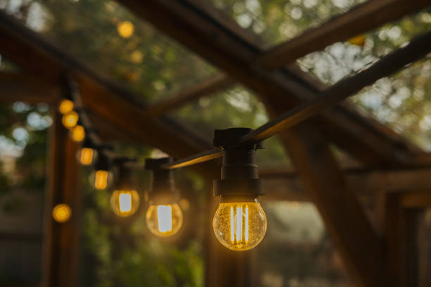 istock Warmly lit string lights create an inviting atmosphere in a wooden outdoor space 2181068408
