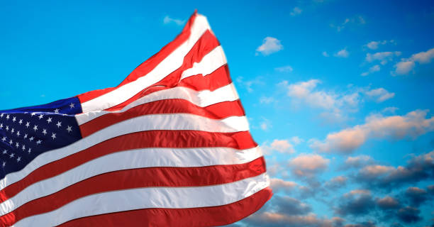 istock American flag over dusk sky 2181068675