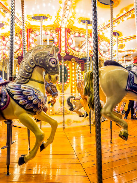 istock Close up empty turning carousel horses  in Christmas market 2181069118