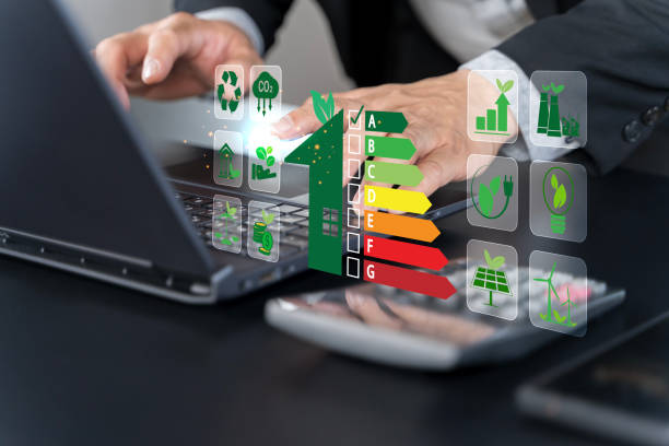 istock Energy efficiency concept. Businessman using laptop with energy efficiency rating symbol 2181069344